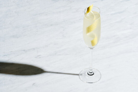 Refreshing French 75 Cocktail on White Marble