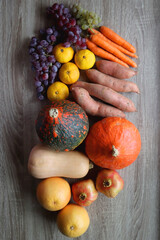 Various healthy autumnal food on wooden table. Top view.