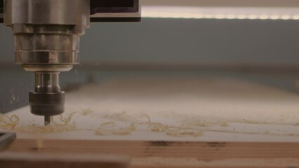 Milling machine with Computer numerical control processes wood blank at high speed.