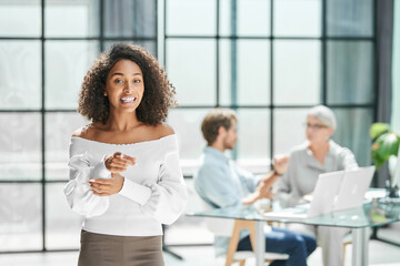 enthusiastic business woman standing in the office .
