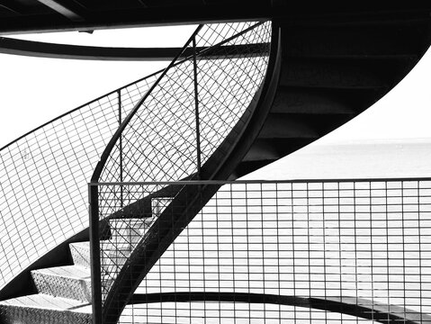 Close up of a beautiful exterior spiral staircase. Black and white