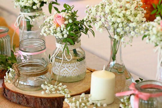 Beautiful floral arrangements, bouquets of flowers in vases and vintage jars
