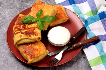 Traditional russian pancakes or blini with curd. Pancakes filled with minced heart or meat