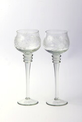 two glasses of champagne for the bride and groom on a white background