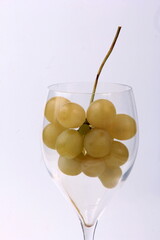 White grapes on glass Wine glasses, white background