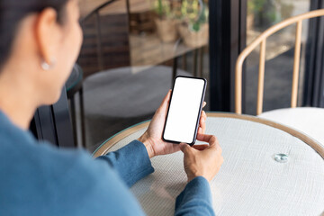 cell phone blank white screen mockup.hand holding texting using mobile on desk at office.background empty space for advertise.work people contact marketing business,technology