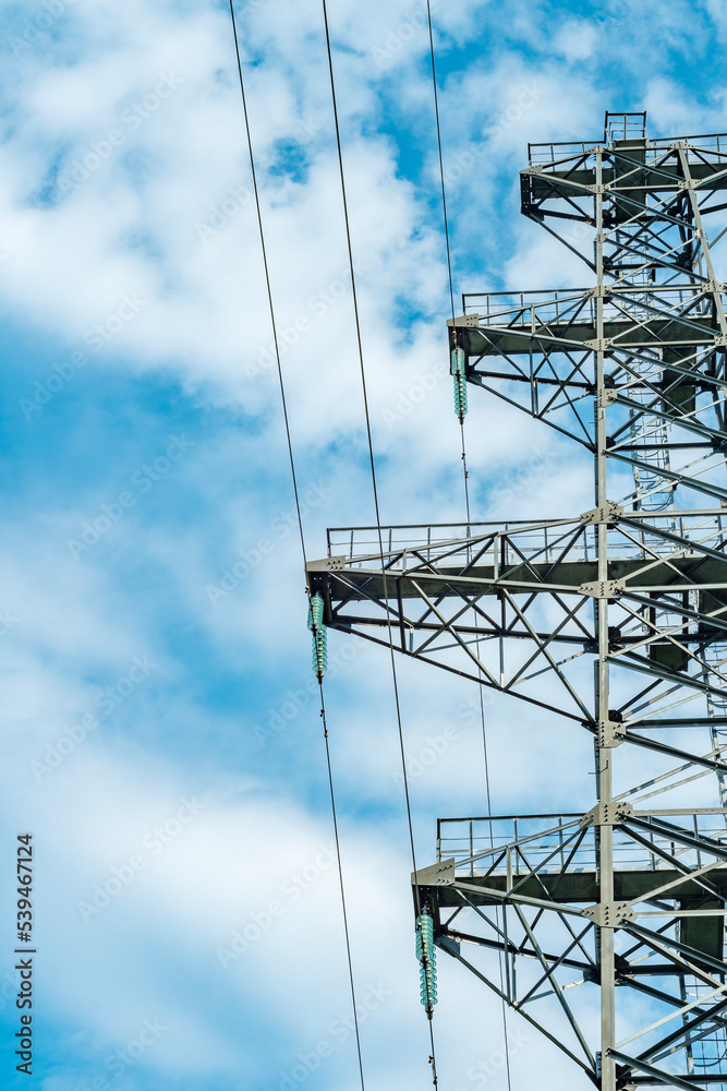 Wall mural countryside electric power transmission line on the background of the sky. three-phase power transmi