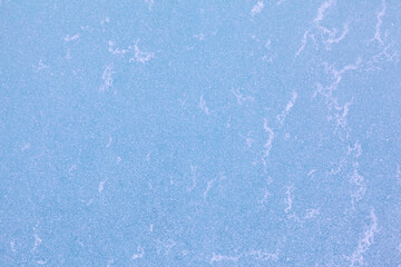 Texture of winter ice surface. Blue natural ice background