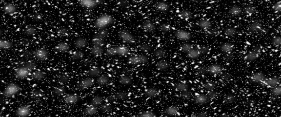 Obraz premium Falling snow isolated on black background. Falling snow at night. Bokeh lights on black background, flying snowflakes in the air. Winter weather. Overlay texture.