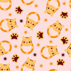 Fototapeta premium Seamless pattern with animals on a pink background. A pattern with a baby rattle in the form of a tiger. Kawaii animals