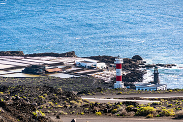 A salt flat in La Palma Island near a lighthouse