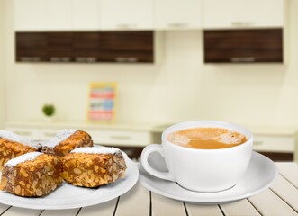 Tasty sweet dessert and a cup of drink on table