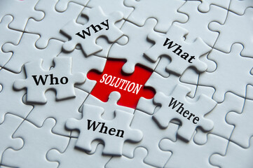 Text on jigsaw puzzle - Why, what, where, who, when and solution. Fact findings and problem solving concept