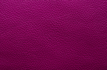Beautiful bright eco-leather, animal skin texture in pink color, close-up as a background.