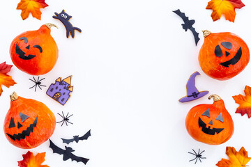 Halloween background with pumpkin head and cookies with black bats, top view