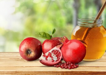 Traditional holliday with fresh pomegranate and honey