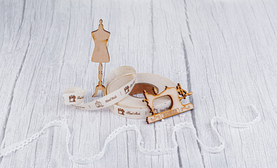 sewing tape, sewing machine and wood mannequin