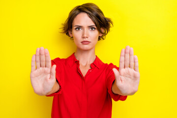 Closeup photo of young funny unhappy serious confident businesswoman wear red shirt showing palms...