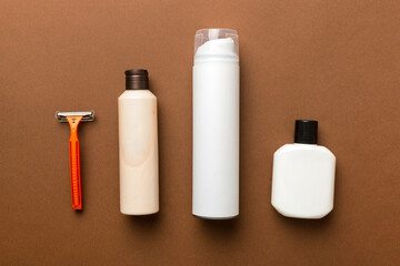 shaving man set. shaving machine, towel, lotion and shaving foam on colored background. Men bath Accessories top view