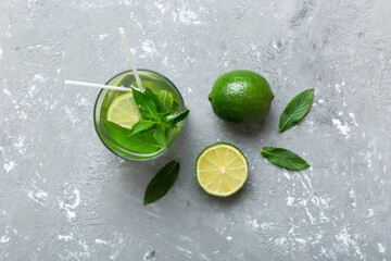 Caipirinha, Mojito cocktail, vodka or soda drink with lime, mint and straw on table background....