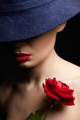 Fototapeta premium Beautiful young Woman In Hat and Flower