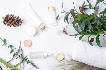 Fototapeta na wymiar moisturizing cream bottle over leaf background studio, packing and skincare beauty concept.