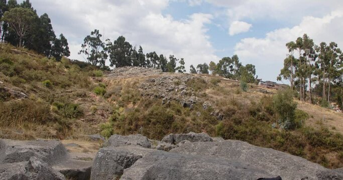 Qenqo carved rocks on side of mountain, Peru - 4k