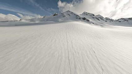 Aerial view raising flight over ski trail touristic winter trekking extreme sport mountain snow sky landscape. FPV drone picturesque alpine resort freeze glacier summit valley freedom panorama cliff