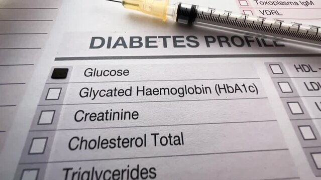 Medical request with result positive to glucose in the diabetes test and syringe insulin for sugar control in blood. medical health report with Test list for diagnosis of diabetes and insulin syringe
