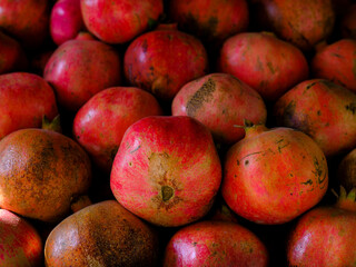 fresh red pomegranates at the market