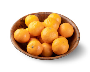 Mini tangerines in a bowl isolated over white background