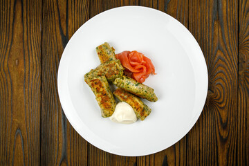 delicious pancakes with salted salmon on a plate.

