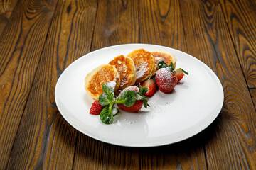 delicious sweet pancakes on a plate.
