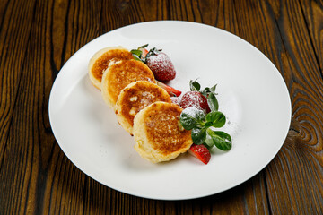 delicious sweet pancakes on a plate.
