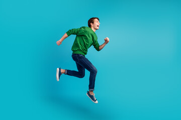 Fototapeta na wymiar Full body photo of running jumping crazy man enjoying discounts isolated vivid color background