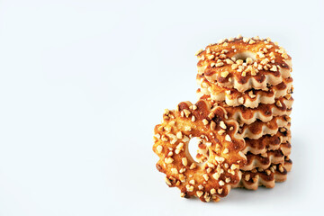 shortbread cookies in the shape of a flower, sprinkled with nuts, on a white background, copy space