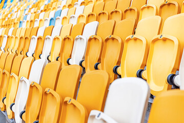 Fototapeta premium Empty stadium seats with the raised lids.