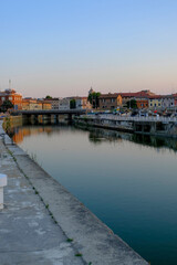 view of the canal of Senigallia, Italy on the sunset over the architecture. Urban view. City postcard