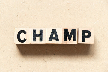 Alphabet letter block in word champ on wood background