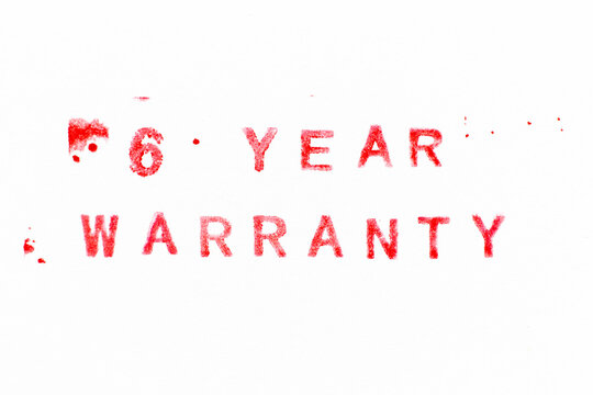 Red color ink rubber stamp in word 6 year warranty on white paper background