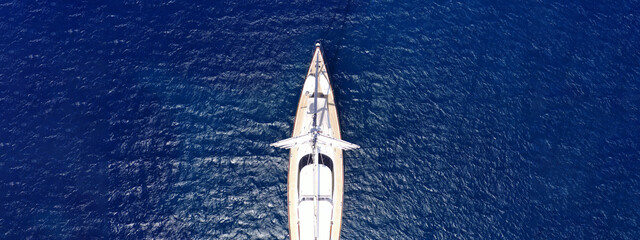 Aerial drone ultra wide panoramic photo with copy space of beautiful sail boat anchored in deep...