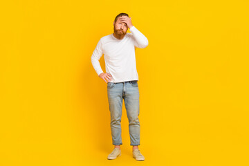 Fototapeta na wymiar Full body photo of beard sick man wear shirt jeans sneakers isolated on yellow color background