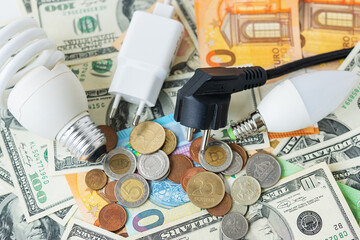 The concept of the energy crisis, price increases. Euro and dollar banknotes, coins on the...