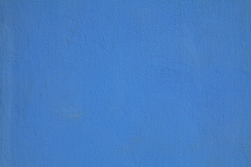 Navy blue or sapphirine wall, texture, background. The building wall, painted with water-based paint. Smooth (flat) surface in blue color with a little stains or dust. Bluish backdrop - obrazy, fototapety, plakaty