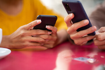 Close up hands holding cell phone