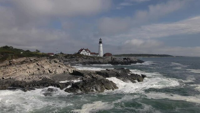 Ocean Lighthouse in Maine, Portland, USA, ocean waves clashes on rocks