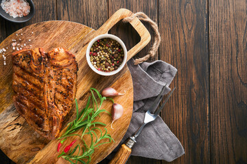 Raw steak t-bone or porterhouse. Steak t-bone or porterhouse in sauce with spices, salt and...