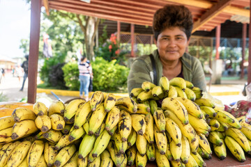Latin woman selling fruits on the street. Self-employment in Nicaragua, Central America