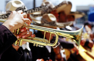 Obraz na płótnie Canvas Mexician musicians performing outdoors.