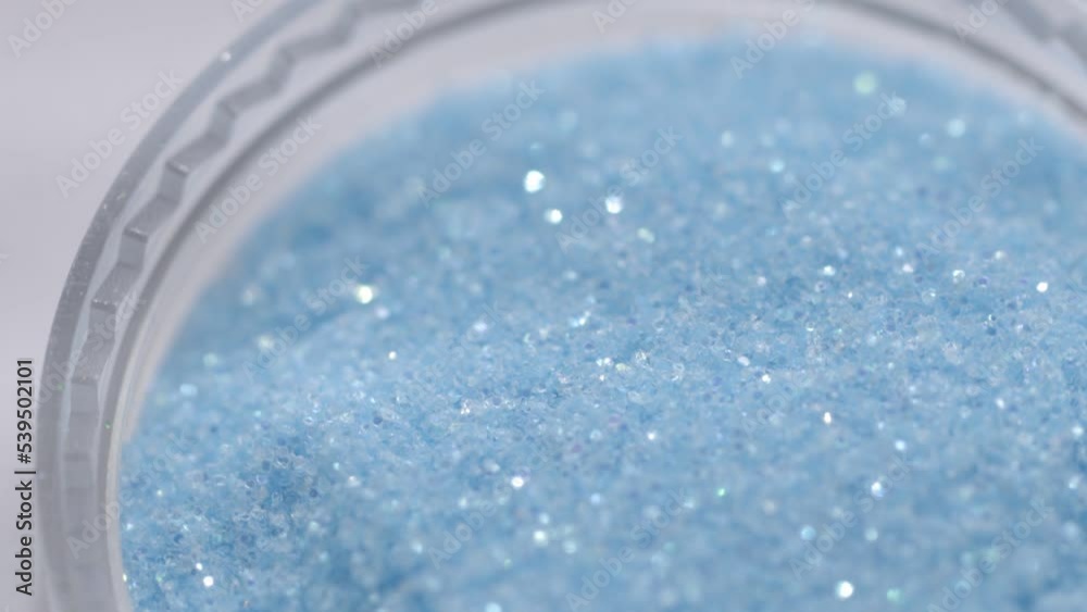 Aufkleber blue sequins in a jar rotate in a circle